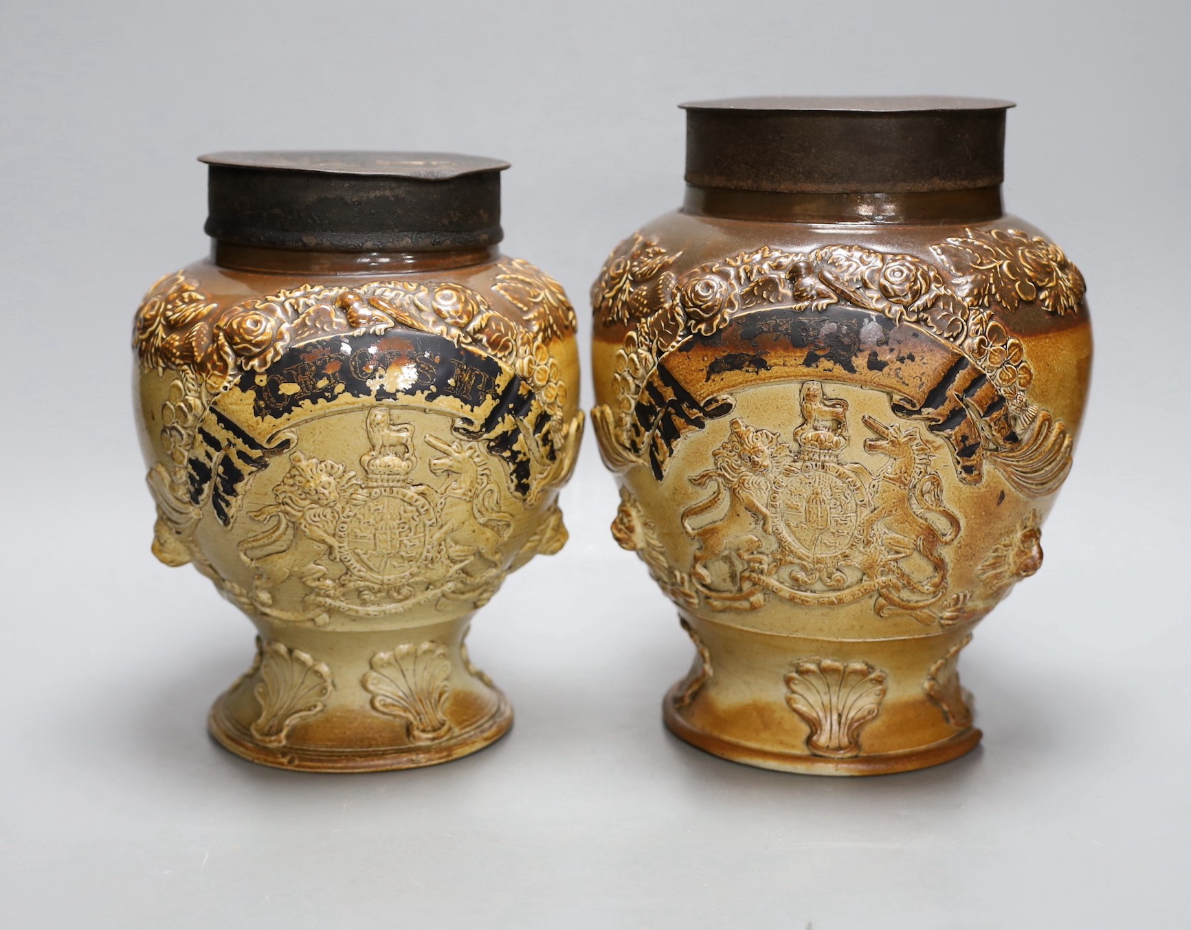 Two 19th century baluster shape salt glazed stoneware storage jars, each with Royal Coat of Arms sprigging, 24cm